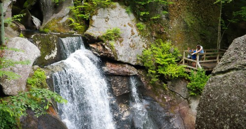 A waterfall cascades at the Lost River Gorge & Boulder Caves in North Woodstock, New Hampshire.