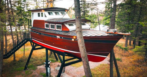 The exterior of the Beverly Boat, a unexpected treehouse Airbnb near Columbia Falls, Montana.