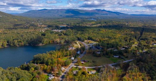 An aerial view of Moultonborough, New Hampshire with a lake to the left of the image.