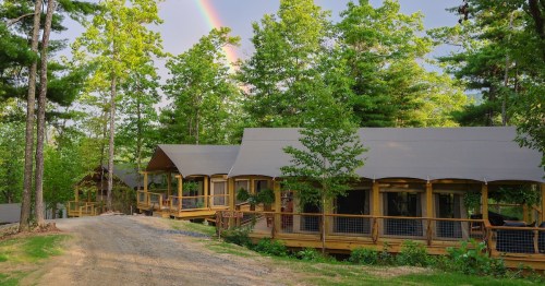 Exterior view of safari tents at a glamping resort in Western North Carolina