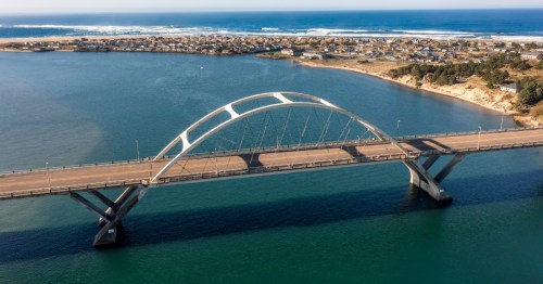 An aerial view of the Alsea Bay Bridge and Waldport, a lesser-known waterfront town in Oregon.