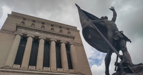 Bronze statue and Neo-Classical architecture at the Indiana World War Memorial.