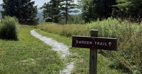 A meandering hiking path winds through a meadow next to the label "Garden Trail" in Vermont.
