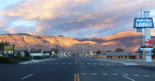Main street with vintage motels and mountains in Hawthorne, Nevada.