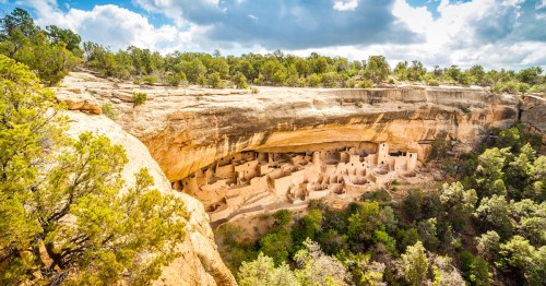 Ancient Ancestral Puebloan cliff dwellings nestled in a rock alcove at Mesa Verde National Park, Colorado.