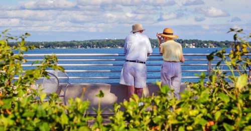 Retirees standing by a lake in Madison, Wisconsin.