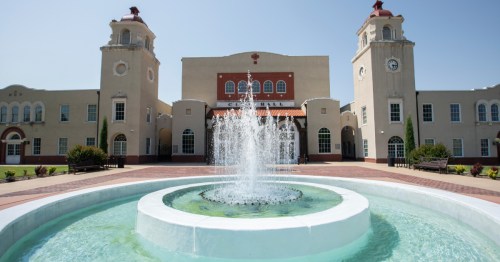 a fountain in front of the ponca city town hall in ponca city oklahoma