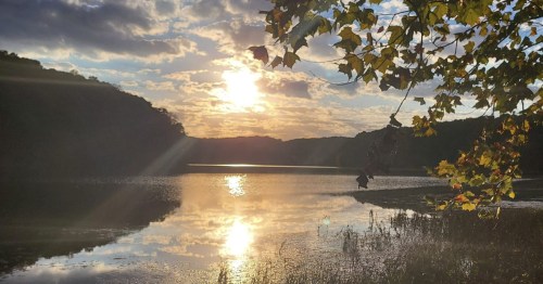 Serene sunset reflecting over the calm waters of Patoka Lake, a popular scenic escape in French Lick, IN.
