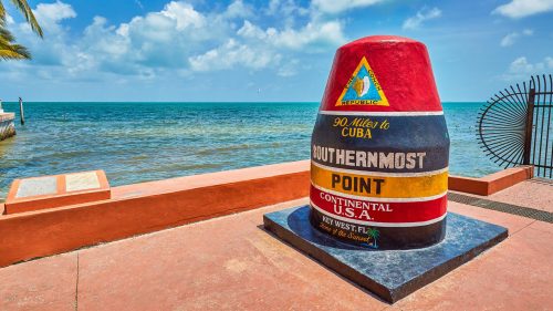 Colorful marker at the Southernmost Point in the continental U.S., overlooking the ocean in Key West, Florida.