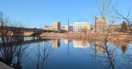 Downtown Missoula is visible across the river, as seen on the Kim Williams Nature Trail in Montana.