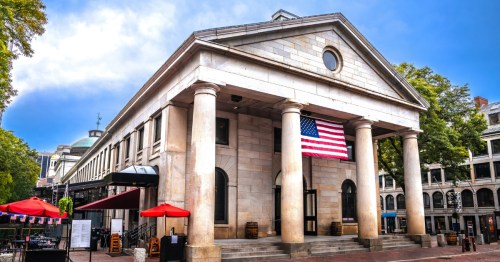 An exterior view of the Quincy Market building at Faneuil Hall Marketplace in Boston, MA.