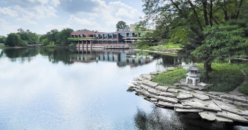 The facade of Hyatt Lodge Oak Brooks, a reinvented Mid Century hotel overlooking a lake. It's on the former MdDonald's camppus and has been turned into a sustainable hotel in Illinois.