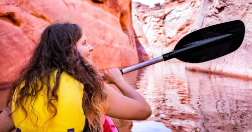 Kayaker paddling along the Colorado River through Antelope Canyon in AZ.