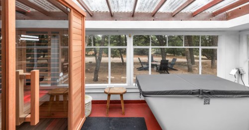 a covered cold plunge and a sauna in a covered outdoor space of a santa fe new mexico airbnb
