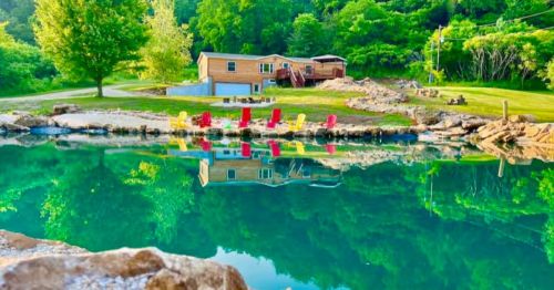 A house with a natural swimming pond in Iowa