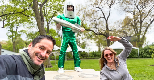 Visiting the Gemini Giant, a 20-foot green alien sculpture. It's a Route 66 attraction in the Illinois quirky small town of Wilmington. Shown here with travel writer, Stephanie Frias, and her husband, Carlos Frias.
