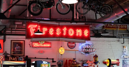 Vintage neon Firestone and beer signs hanging at Chloe's Diner in Ohio.