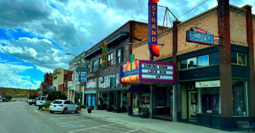 Colorful downtown theater marquee and historic storefronts in Helper, Utah.