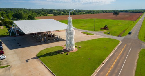 Aerial view of the iconic roadside gas station and giant bottle sculpture in Arcadia, Oklahoma.