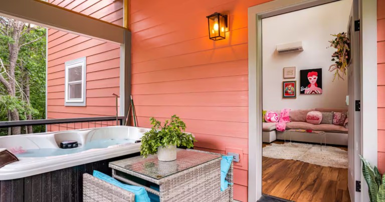 The hot tub on the porch at the pink Barbie Palace AIrbnb property in Black Mountain, North Carolina.