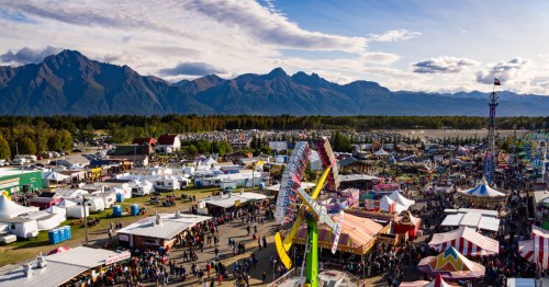 The aerial view of the Alaska State Fair with mountains in the background.