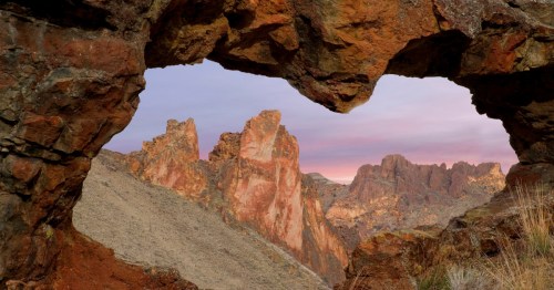 USA, Oregon. View of Leslie Gulch through rock opening