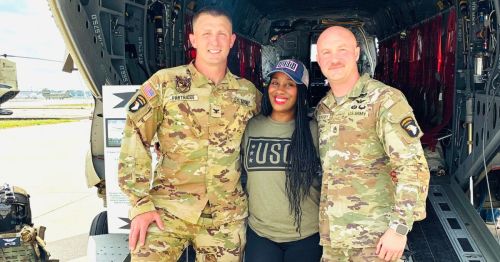 Journalist and travel writer Lynnette Nicholas with two active servicemen at Fort Campbell.