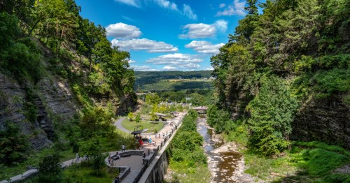 An overhead view of the pedestrian walkway at Watkins Glen State Park, overlooking a large gorge in New York