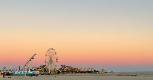 A sunset view of the beach and amusement park in Wildwood, New Jersey.