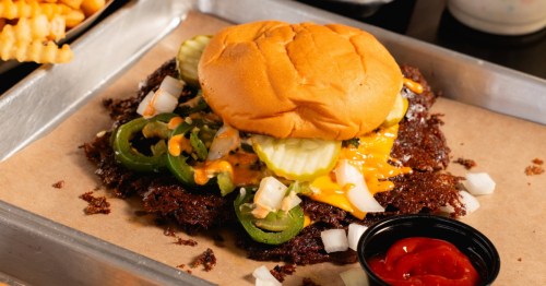 A beautiful smash burger on a tray from ZOJAH Burgers in San Antonio
