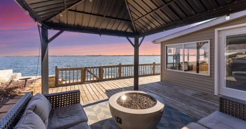 A deck overlooking Lake Madison at sunset in South Dakota