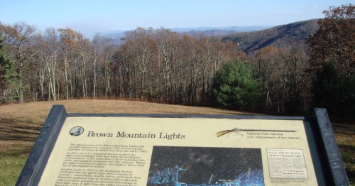 Sign marker indicating Brown Mountain Lights at a designated overlook in western North Carolina in the late fall.