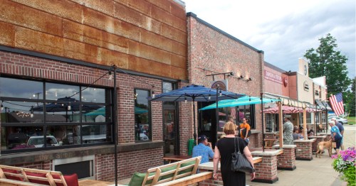 Outdoor patio dining and storefronts in Grayling Michigan
