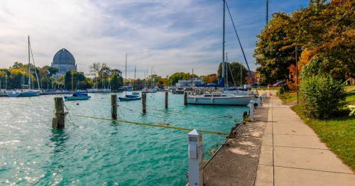 Wilmette Harbor in the daytime with boats and clear blue water in Wilmette, Illinois