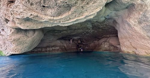 A hidden cave inside Tonto National Forest in AZ, featuring a crystal clear pool.