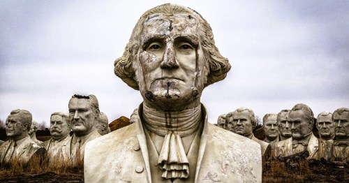 A giant bust of George Washington surrounded by other former presidents in a park in Virginia.