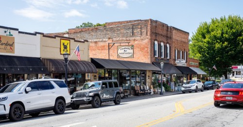View of downtown Landrum, SC, lined with brick buildings and storefronts.