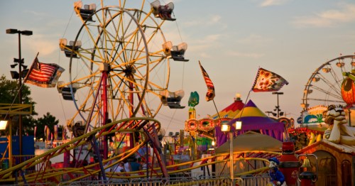 amusement rides including a ferris wheel and roller coaster at the ohio state fair