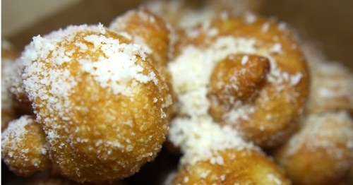Freshly baked garlic knots topped with cheese at Pizza Bruno in Orlando, FL.