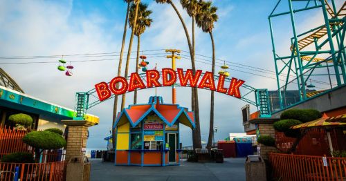 A sign reading, "Boardwalk," sits at the entrance of the Santa Cruz Beach Boardwalk in Santa Cruz, California.