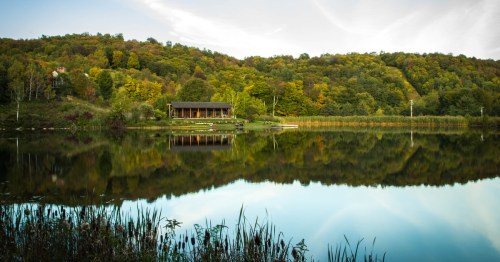View of Silver Lake in Barnard, Vermont, with green hills surrounding it.