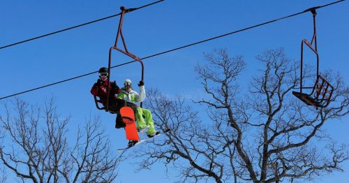 Skiers on a chairlift in Wisconsin
