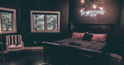 The gothic-style bedroom area of the Wednesday's Lair Airbnb in Lincoln, Illinois.