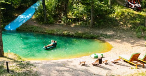 Guest relaxing on a float in a private swimming hole pond in Gahanna, Ohio.