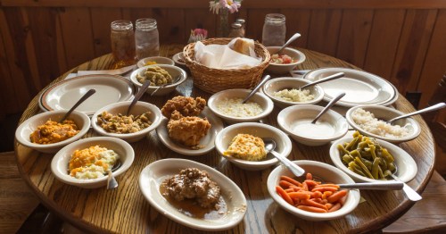 Table full of all-you-can-eat food, country southern dishes
