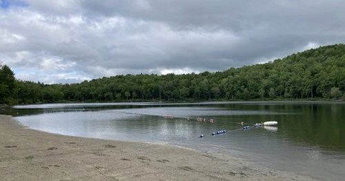 A beach on a hidden lake in Massachusetts.