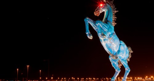 A photo of Blucifer, the blue horse sculpture sitting outside of the Denver International Airport.