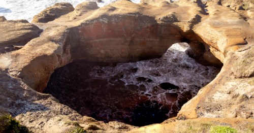 Looking down into the Devils Punchbowl, a collapsed sea cave along the Oregon Coast.