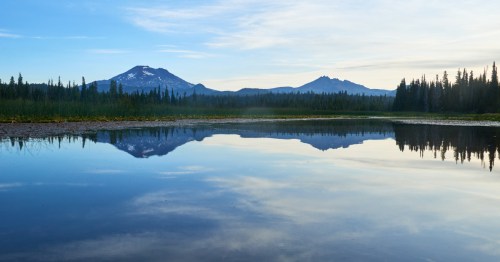 Early morning panoramic view of the South Sister mountain from the Hosmer Lake in central Oregon.