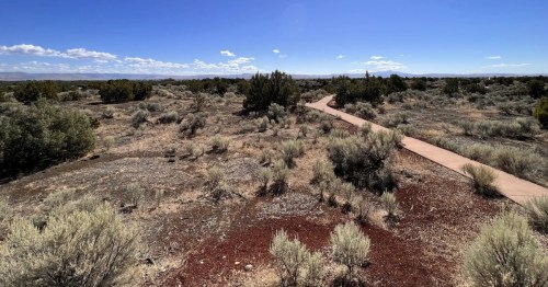 A paved path winds through hardened lava flow in southeastern Idaho.